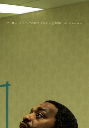 Zielony plakat. Na samym dole głowa przestraszonego mężczyzny